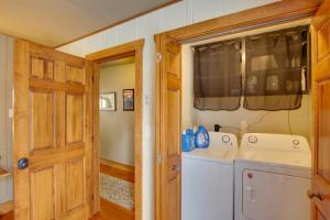 a laundry room with a washer and dryer at Cozy Lead Cabin with Deck Less Than 1 Mi to Ski Slopes! in Lead +31 photos