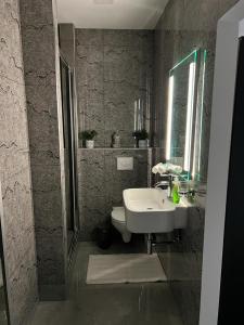 a bathroom with a sink and a toilet at Neagoe residents in Birkirkara