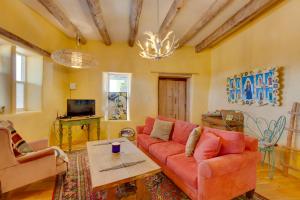 a living room with a couch and a table at Santa Cruz Home with Mountain Views! in Santa Cruz
