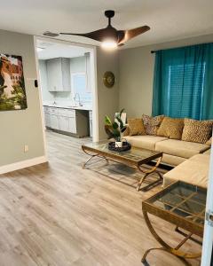 a living room with a couch and a table at 3bdrm Fruit Tree Home near downtown Orlando in Orlando