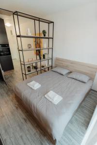 Voodi või voodid majutusasutuse Apartman Resident toas