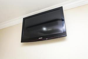 TV a/nebo společenská místnost v ubytování Hotel Tenda Jaçanã