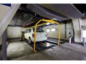 a white car is parked in a parking garage at Hotel Alpha Inn Akita - Vacation STAY 67288v in Akita