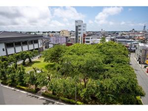 a view of a city with trees and buildings at Misawa City Hotel - Vacation STAY 81764v in Misawa