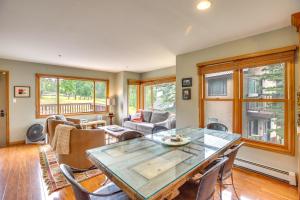 a living room with a table and chairs at Mountain Village Home Steps to Ski Lift and Shuttle! in Telluride