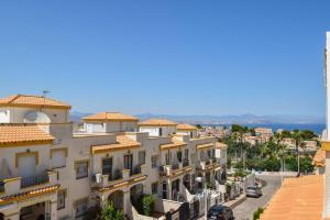 a view of a building on a city street at Great Sun Terrace Close to Beach in Gran Alacant