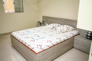 Postel nebo postele na pokoji v ubytování Hotel Tenda Jaçanã