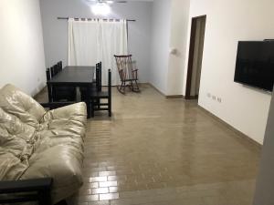 a living room with a couch and a table at Departamento 4 dormitorio in Corrientes