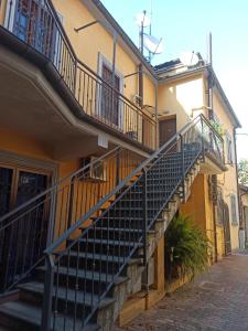 a building with stairs on the side of it at CASA.AD in Bracciano