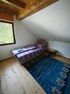 Voodi või voodid majutusasutuse Mini Garden toas