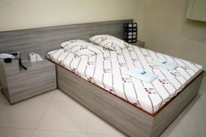 Postel nebo postele na pokoji v ubytování Hotel Tenda Jaçanã