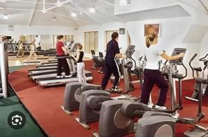 a group of people exercising in a gym at Heyward mews holiday homes in Dublin