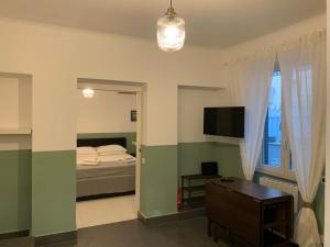 TV a/nebo společenská místnost v ubytování "CITY CENTER 10Stars"- Casetta Matteotti- Feel like HOME