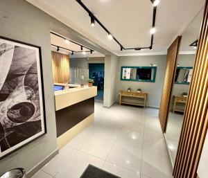 a large kitchen with a large white tile floor at HLN Hotel - Expo - Anhembi in São Paulo