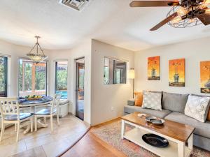 a living room with a couch and a table at Sedona's Paradise Found, Saltwater Pool and Hot Tub, Private Oasis! in Sedona