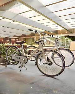 a white bike on display in a building at Brickell Bliss - Luxury Condo in Miami
