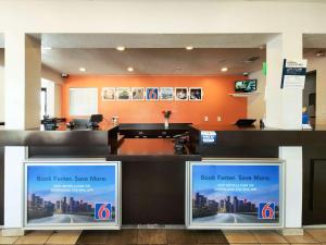 a lobby of a hotel with a check in counter at Motel 6-Baytown, TX - Baytown East in Baytown