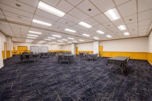 a large room with tables and chairs in it at Quality Inn & Suites Canon City in Canon City