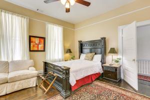 a bedroom with a bed and a couch at Central Albany Home with Covered Porch and Patio! in Albany