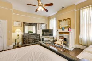 a living room with a bed and a fireplace at Central Albany Home with Covered Porch and Patio! in Albany