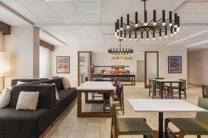 a living room with a couch and a table at Hampton Inn Stockton, Ca in Stockton