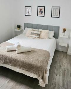 En eller flere senge i et værelse på Apartamento Centro Parras Málaga City