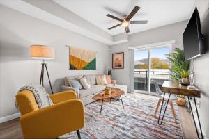 a living room with a couch and a table at City View BOHO Apt Stocked w everything you need in Salt Lake City
