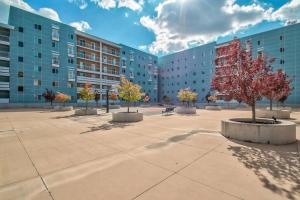 a courtyard with trees in front of a building at City View BOHO Apt Stocked w everything you need in Salt Lake City