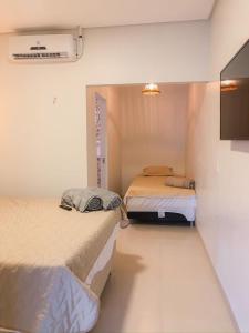 Katil atau katil-katil dalam bilik di Chalés da Chapada