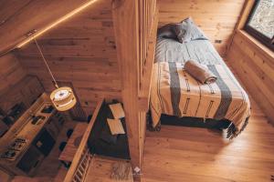 an overhead view of a bedroom in a log cabin at Yuki Yama in Malalcahuello