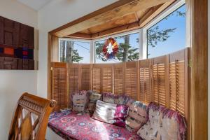 a living room with a couch and a large window at Whale Vista in Depoe Bay +42 photos