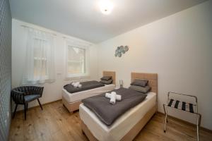 Posteľ alebo postele v izbe v ubytovaní Grace Pine Apartment 2