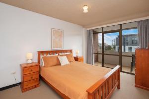 Ένα ή περισσότερα κρεβάτια σε δωμάτιο στο Fountain Court 25