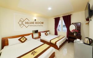 Postel nebo postele na pokoji v ubytování An Phu Hotel Da Lat
