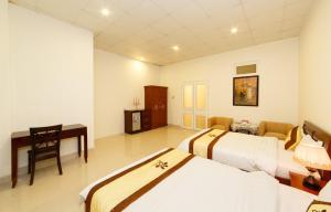Postel nebo postele na pokoji v ubytování An Phu Hotel Da Lat