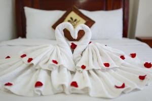 Postel nebo postele na pokoji v ubytování An Phu Hotel Da Lat