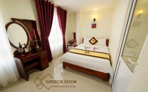 Postel nebo postele na pokoji v ubytování An Phu Hotel Da Lat