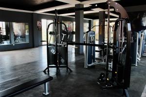 a gym with several tread machines in a room at "San Miguelito" El oasis urbano que necesitas para descansar! pool, gym, tenis in San Miguel de Allende