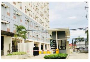 a building on a city street with a building at Amaia Steps Condominium Studio -across Ayala Mall Capitol Central in Bacolod