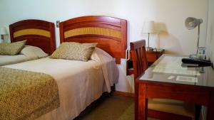 Postel nebo postele na pokoji v ubytování Hotel Ontiveros