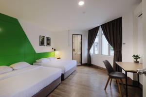 Giường trong phòng chung tại Polaris Suite