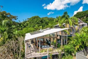 a house on a hill with trees at Above The Pass in Byron Bay