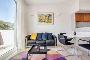 a living room with a couch and a table at Sustainable Luxury in Australia's 1st Passive Apartment in Sydney