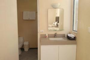 a bathroom with a sink and a mirror at Marysol beachfront next to nomads d4 in Isla Mujeres +17 photos