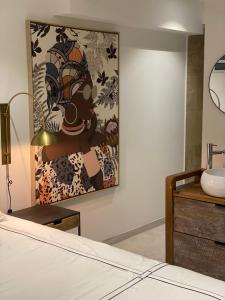 Letto o letti in una camera di Les Appart villa Sunbay Caraibes avec piscine privative vue mer et montagne