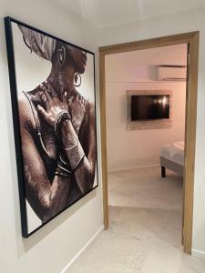 TV o dispositivi per l'intrattenimento presso Les Appart villa Sunbay Caraibes avec piscine privative vue mer et montagne