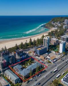 an aerial view of a city and the beach at Oceanside Cove in Gold Coast