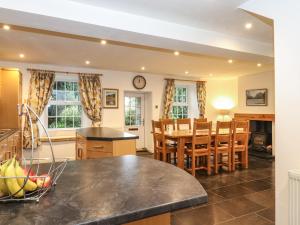 a kitchen and dining room with a table and chairs at Coombe Cottage in Borrowdale