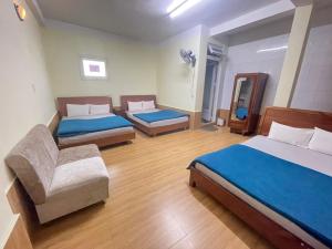 Postel nebo postele na pokoji v ubytování Hân Hoan Hotel