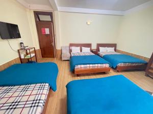 Postel nebo postele na pokoji v ubytování Hân Hoan Hotel